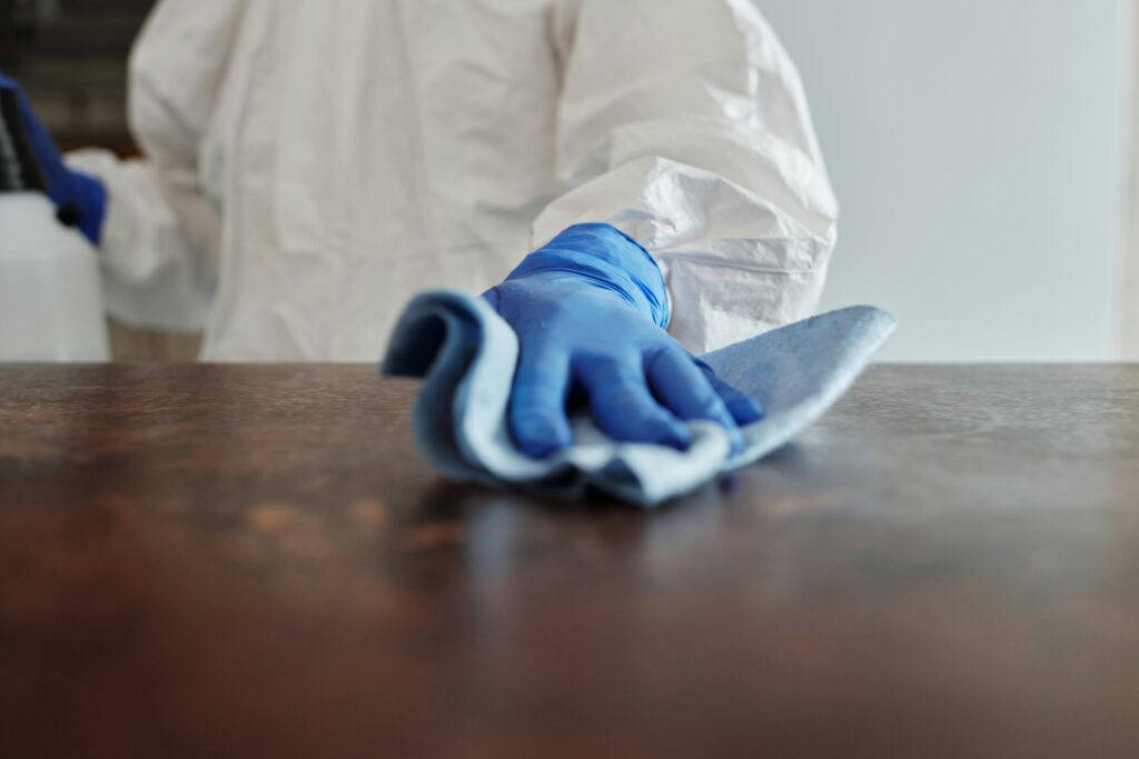 pexels-photo-4099467-4099467 Close-Up Photo Of Person Cleaning The Table